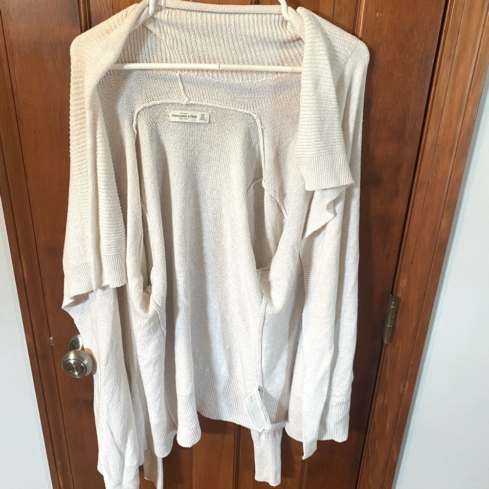 White/cream colored cardigan